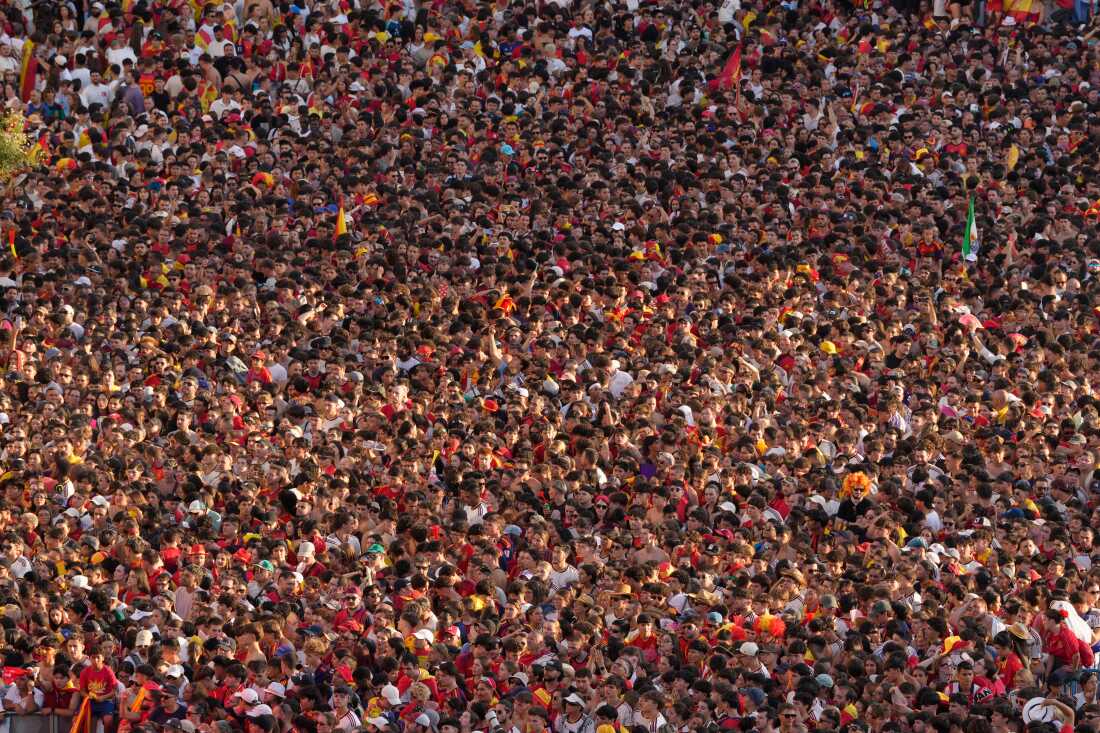 Fans crowd together as they wait for the arrival of players from Spain's national soccer team in Madrid on Monday, July 20, 2026, after Spain defeated Argentina in the World Cup final in East Rutherford, N.J., near New York.