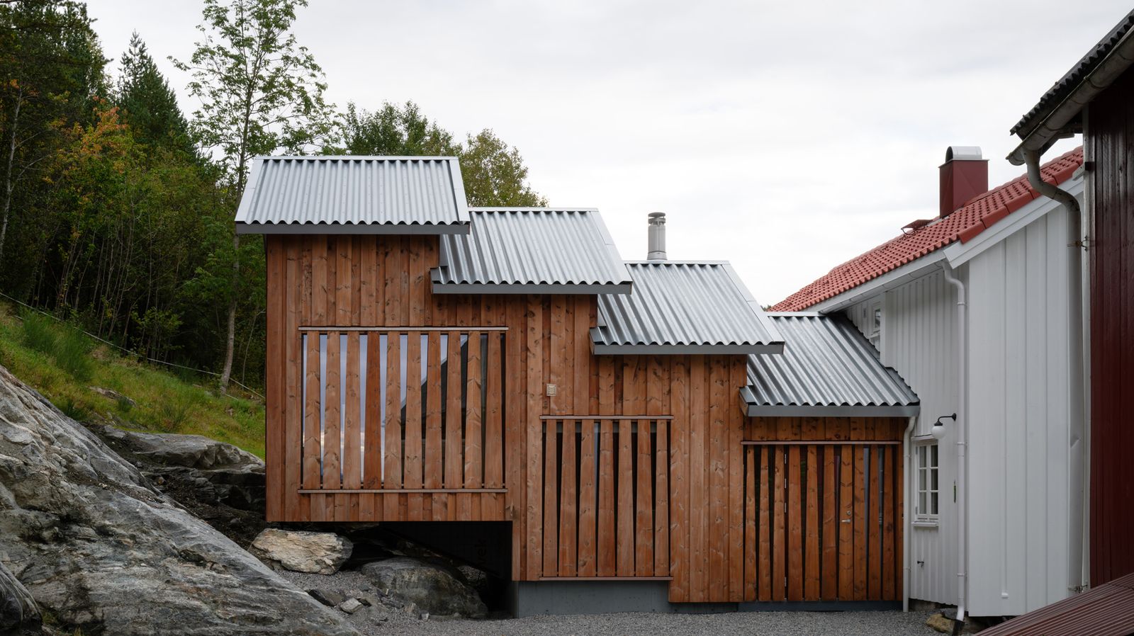 A Timber Extension Climbs the Hillside Behind This Rural Norwegian Home