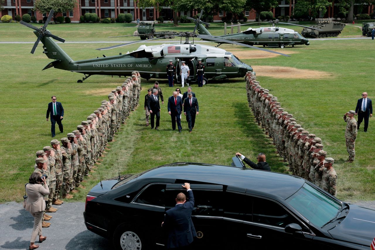 US President Donald Trump walks with Sen. Dave McCormick, Dina Powell McCormick, Defense Secretary Pete Hegseth and Army Secretary Daniel P. Driscoll after arriving aboard Marine One, in Carlisle, Pennsylvania, on July 15.