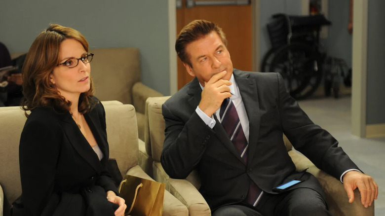 Liz and Jack looking at someone on 30 Rock