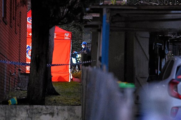 Investigators work to identify the three people killed in the fire.