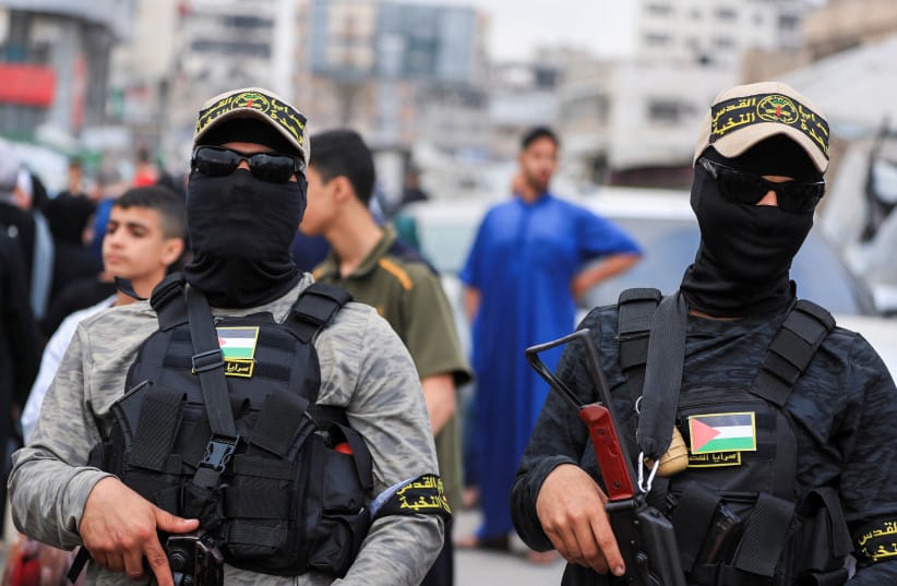 Terrorists from Palestinian Islamic Jihad's al-Quds Brigades stand guard on the street during an Eid al-Adha celebration in Gaza City, May 27, 2026; illustrative.