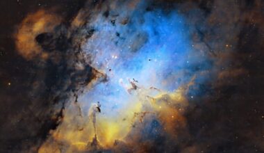 An eagle-shaped, expansive swirl of yellow and blue nebulosity with numerous background stars.