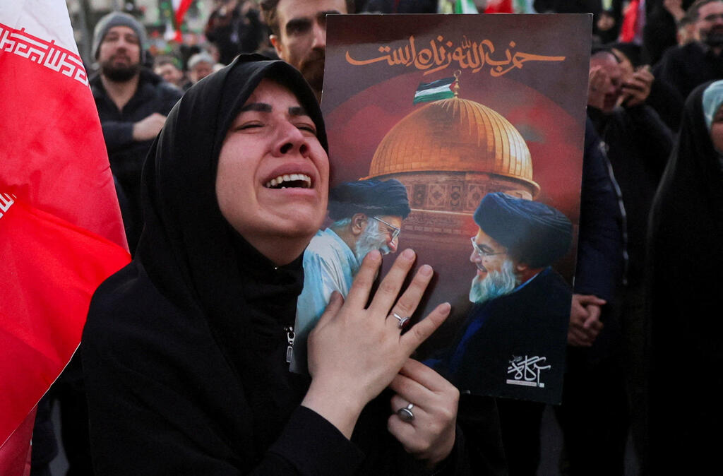 Photo: Majid Asgaripour/WANA (West Asia News Agency) via REUTERS טהרן איראן אישה בוכה אחרי חיסול עלי חמינאי