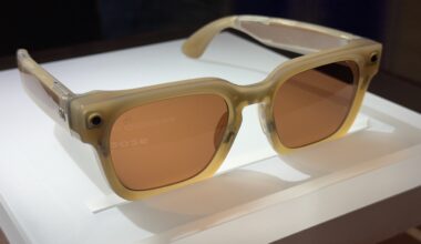 A pair of Meta smart glasses on a white pedestal
