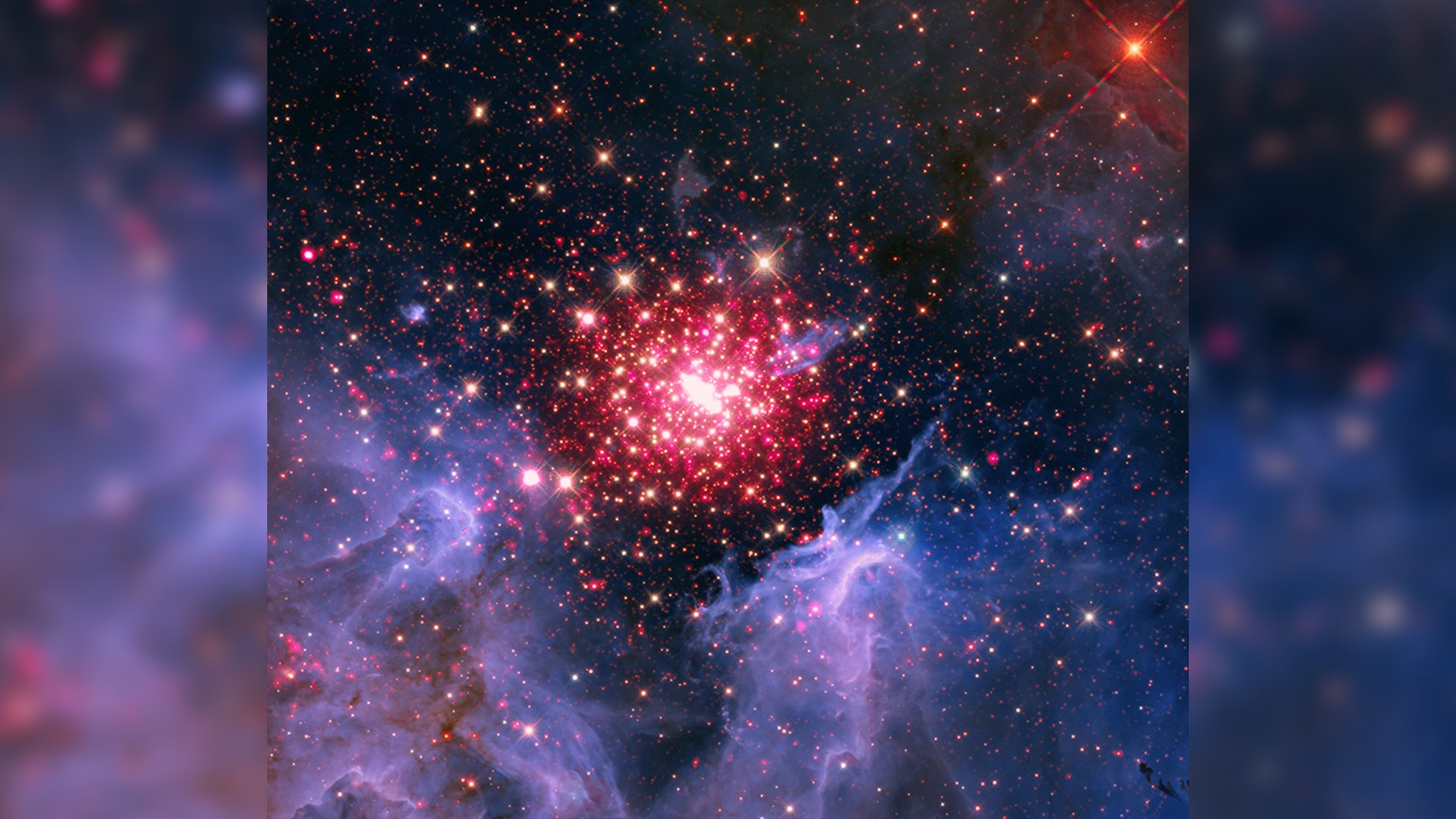 a swirl of blue-and-purple gases amid red pinpoints of light, on a black background