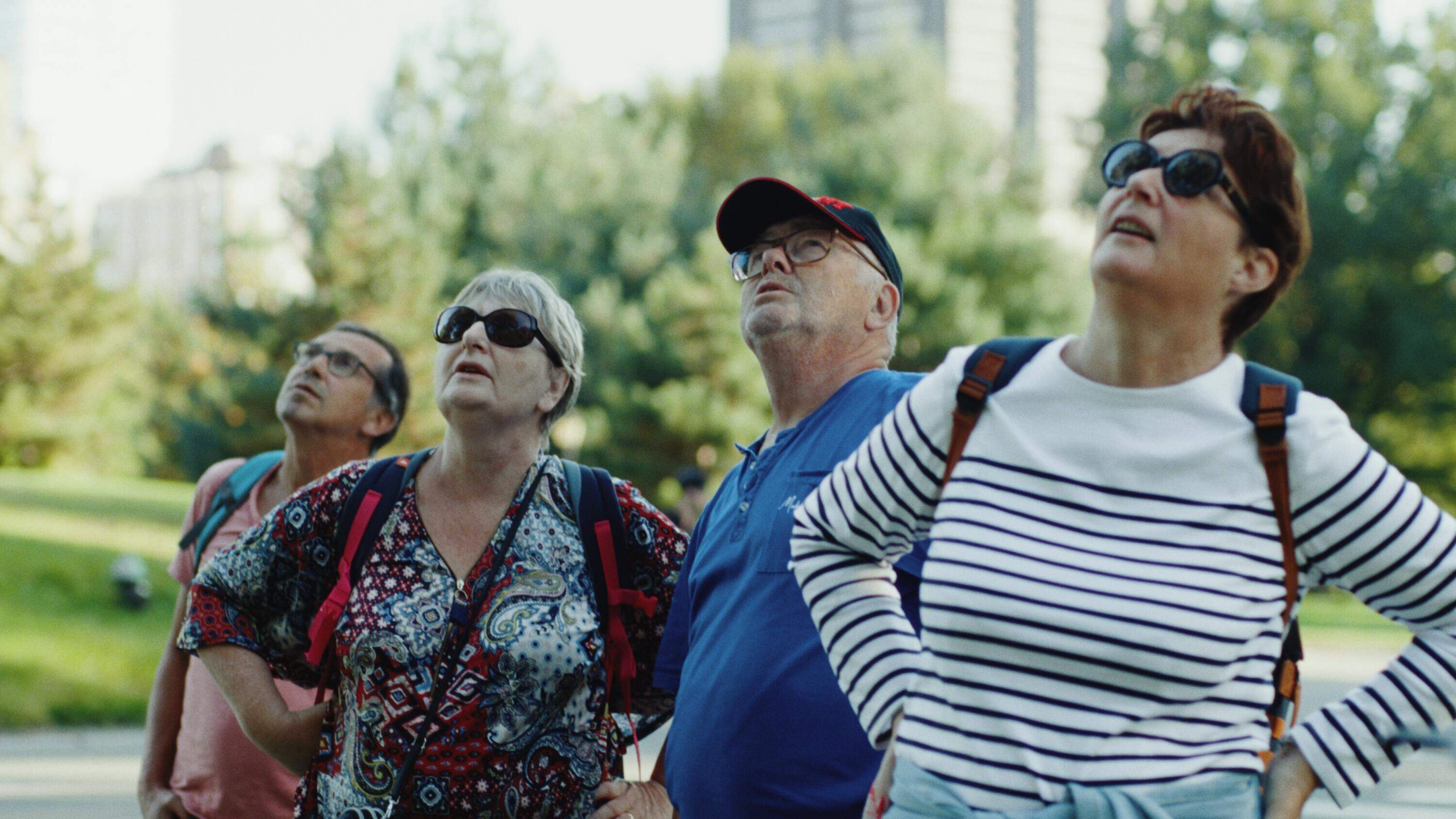 People look up at Flaco in still from director Penny Lane's documentary "Wild Inside." (Courtesy Sandbox Films)