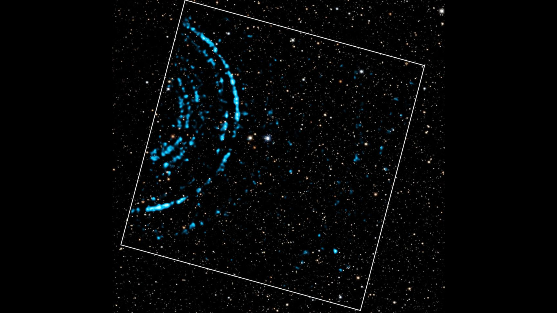 Against a background of stars are bright blue lights that create a series of speckled rings echoing outward.