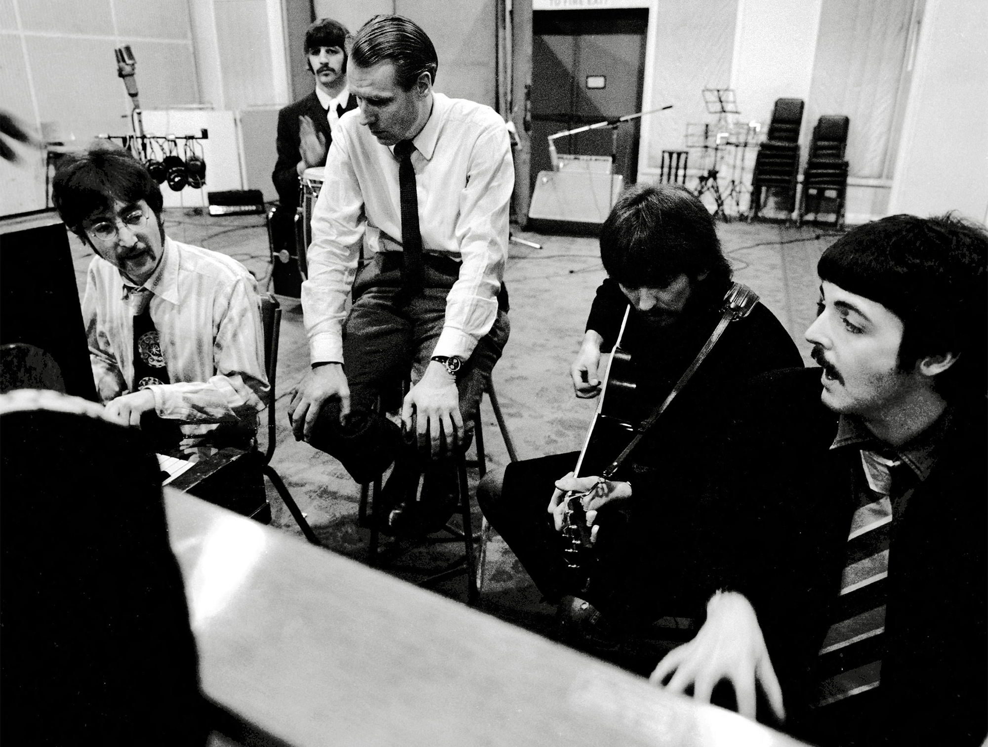 Publicity photo of the Beatles, John Lennon, Ringo Starr, George Martin, George Harrison, Paul McCartney and producer George Martin in the Studio Recording session for the album Sgt Pepper's Lonely Hearts Club Band 1967