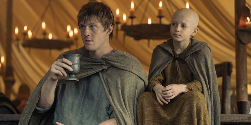 Peter Claffey as Dunk sitting with Dexter Sol Ansell as Egg in A Knight of the Seven Kingdoms Season 1