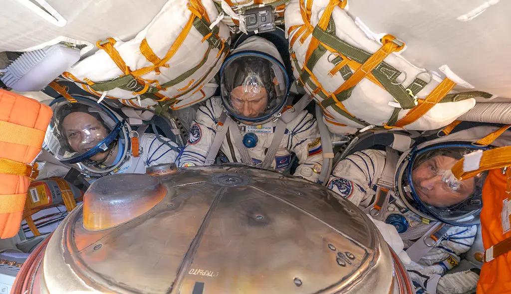 The astronaut and two cosmonauts inside the space craft (Bill Ingalls/NASA via Getty Images)