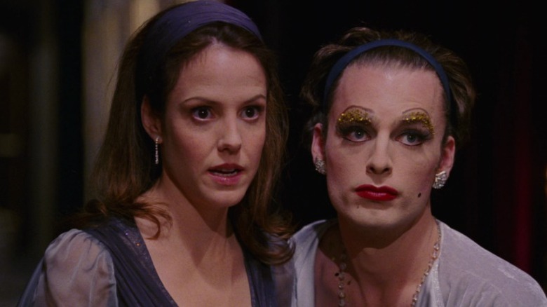 Harper and Prior sitting side by side and looking in a mirror on Angels in America S1E1