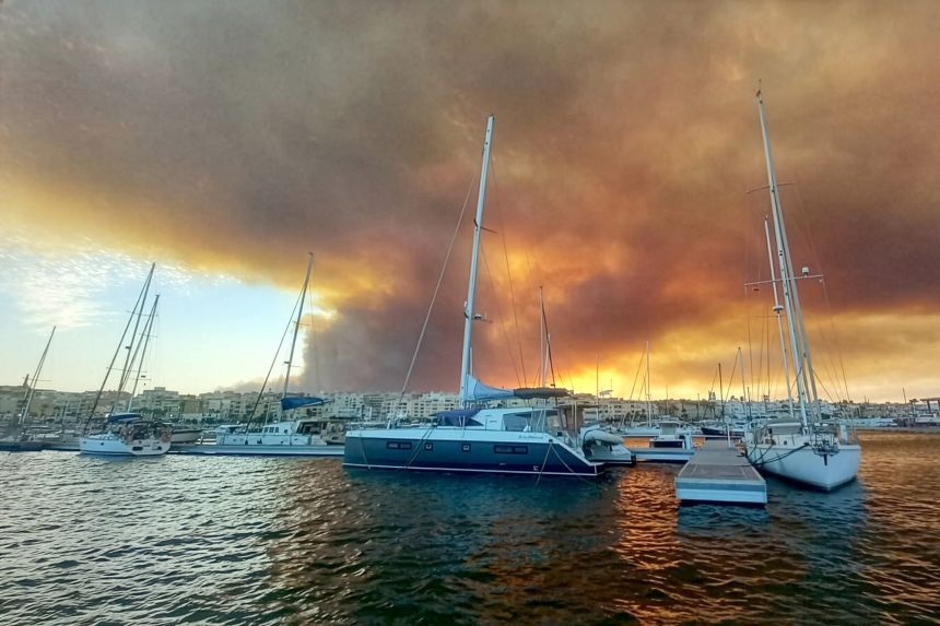 The fire in Los Gallardos is seen from Spain's Port of Garrucha on Friday.