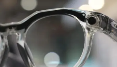 Close up of the camera installed in the frame of a pair of Meta AI glasses.