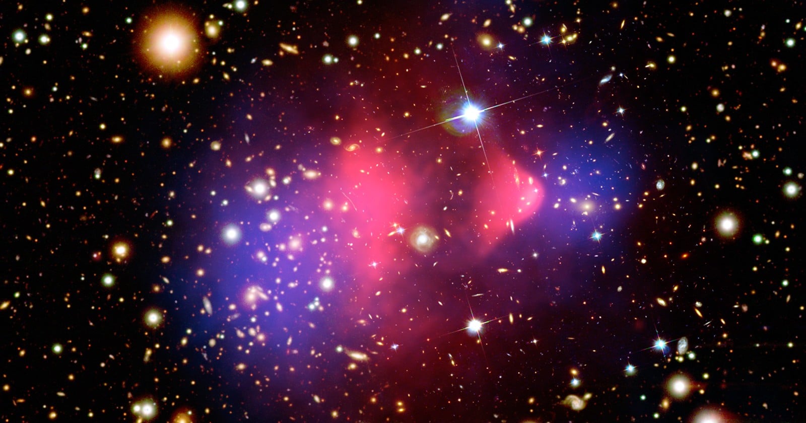 Astronomers found a third galaxy with almost no dark matter, and all three sit on the same straight line — pointing to a collision that tore ordinary matter loose