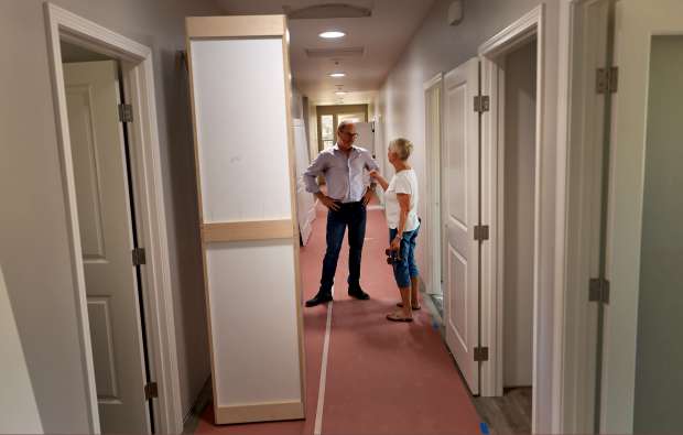 Buckelew CEO Chris Kughn, left, and Cindy Gallaher discuss the progress of Hope Village in Santa Rosa, Tuesday, Aug. 15, 2023. (Kent Porter / The Press Democrat)