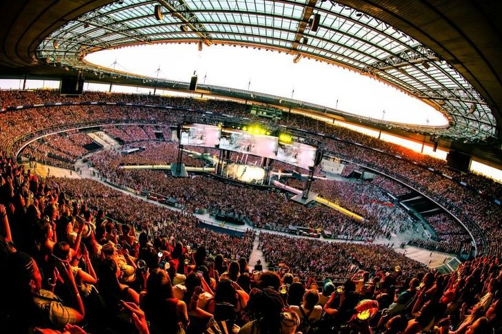 Members of K-pop band BTS perform at the Stade de France in Paris, Friday (local time), as fans pack the stadium for the first night of its weekend shows in the French capital. Courtesy of BigHit Music