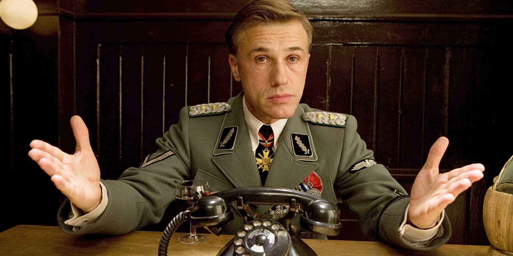 Christoph-Waltz spreading his arms in Inglourious-Basterds