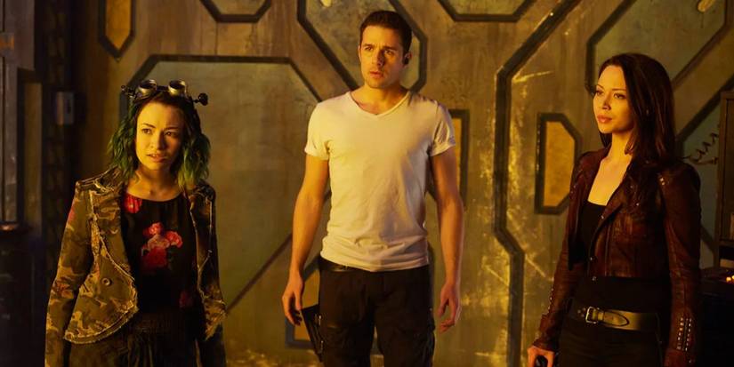Three characters standing together in the SYFY series 'Dark Matter'