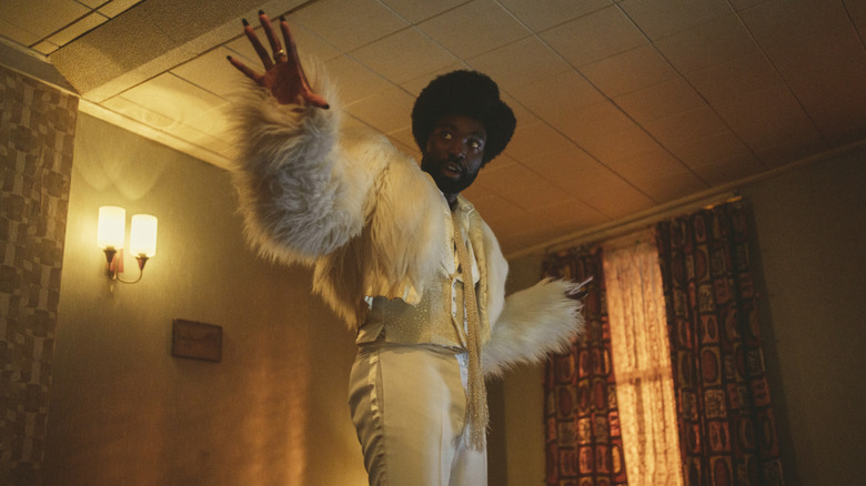 Paapa Essiedu's Gaap wearing flamboyant white clothes on Black Mirror