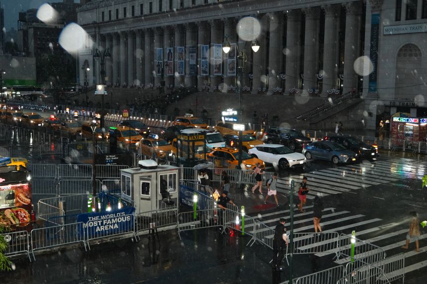 Rains falls outside Madison Square Garden during Taylor Swift and Travis Kelce's wedding on Friday, July 3.