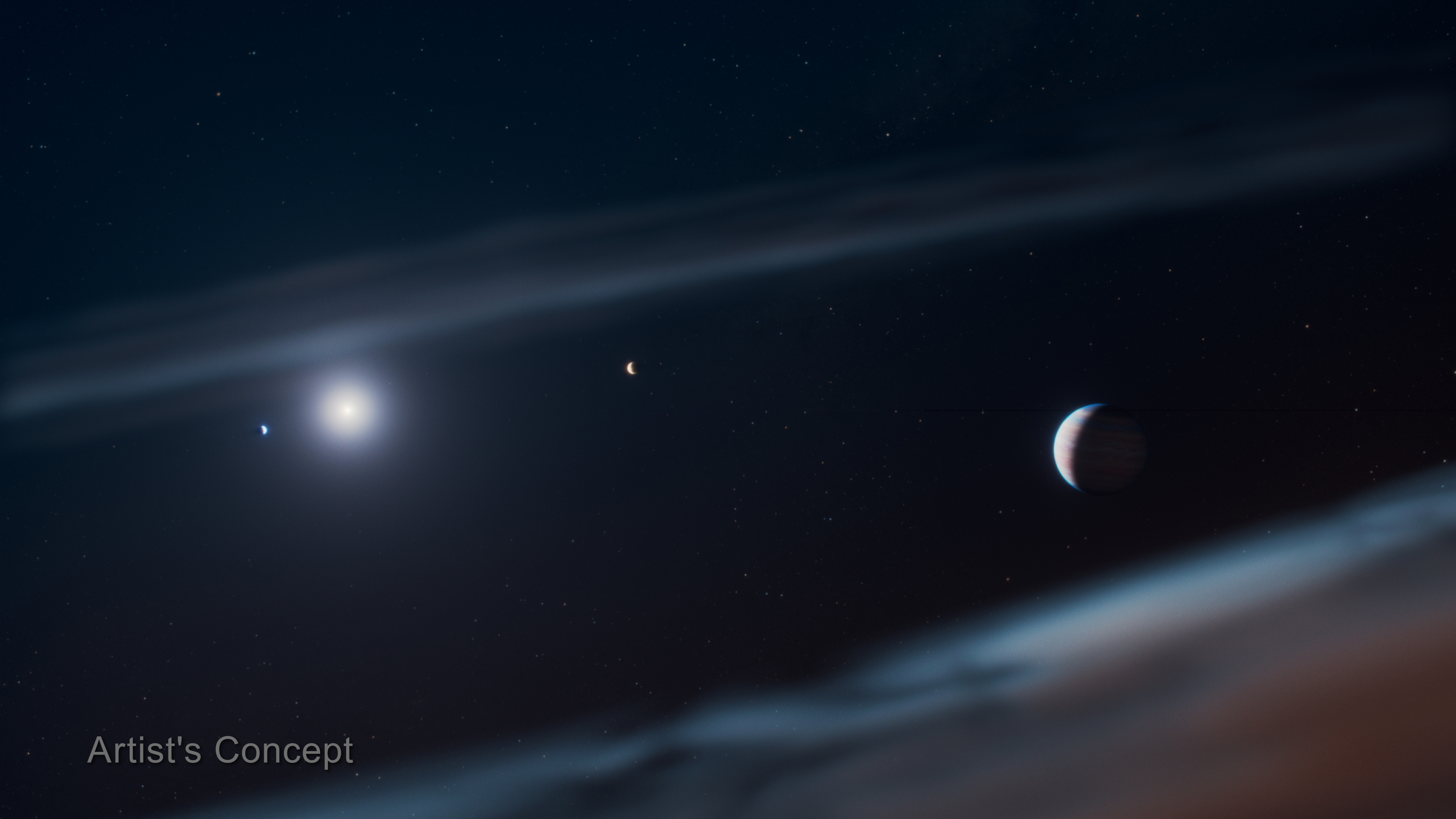 An artist's rendering of what Beta Pictoris planetary system may look like from space, with the new Beta Pictoris d on the right