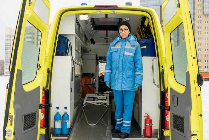 Paramedic standing in the back of an ambulance, considering what doctors do when patient is faking it.