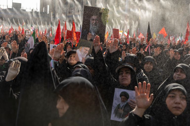 TEHRAN, IRAN - JULY 5: People gesture as they hold portraits of Iran's late Supreme Leader, Ayatollah Ali Khamenei, during the second day of his funeral ceremonies at the Grand Mosalla on July 5, 2026 in Tehran, Iran. Khamenei and members of his family were killed on February 28 during U.S.-Israeli strikes at the beginning of the war, bringing an end to his 36-year rule over Iran. A multi-city state funeral will be held over six days before his body is laid to rest on July 9, in his hometown of Mashhad, Iran. (Photo by Majid Saeedi/Getty Images)
