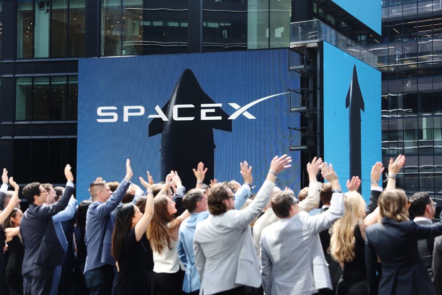 SpaceX signage during the closing bell ceremony at the Nasdaq MarketSite in New York on June 12, 2026. Shares of SpaceX climbed in their first day of trading and instantly turned the crown jewel of Elon Musk's business empire into one of the most valuable public companies in the world.