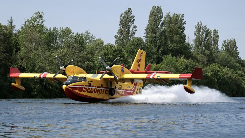 Planes scoop up water from River Seine to battle wildfire near Paris