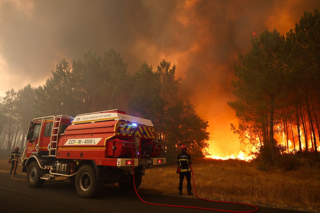 Firefighters try to extinguishing fires using a wildland water truck near Le Porge, southwestern France on July 23, 2026.