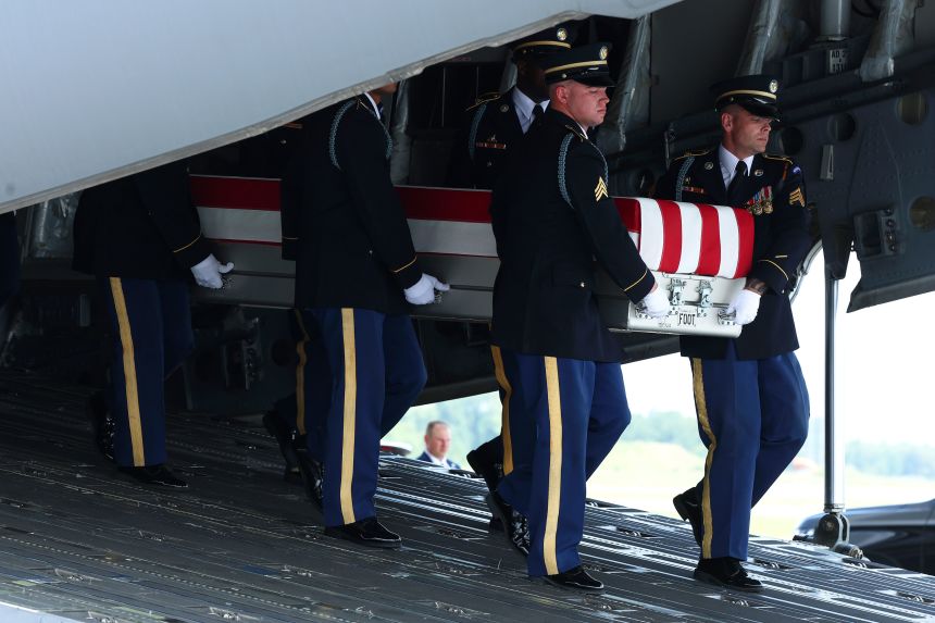 Members of a US Army carry team move the flag-draped transfer case holding the remains of Army Pvt. Isabella Gonzales, of Carrollton, Texas, during a dignified transfer at Dover Air Force Base on Wednesday.