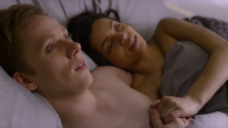 Joe Cole's Frank and Georgina Campbell's Amy in a bed on Black Mirror
