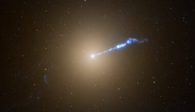 The powerful jet emanating from the supermassive black hole at the center of the M87 galaxy. Credit: NASA/ESA/STScI