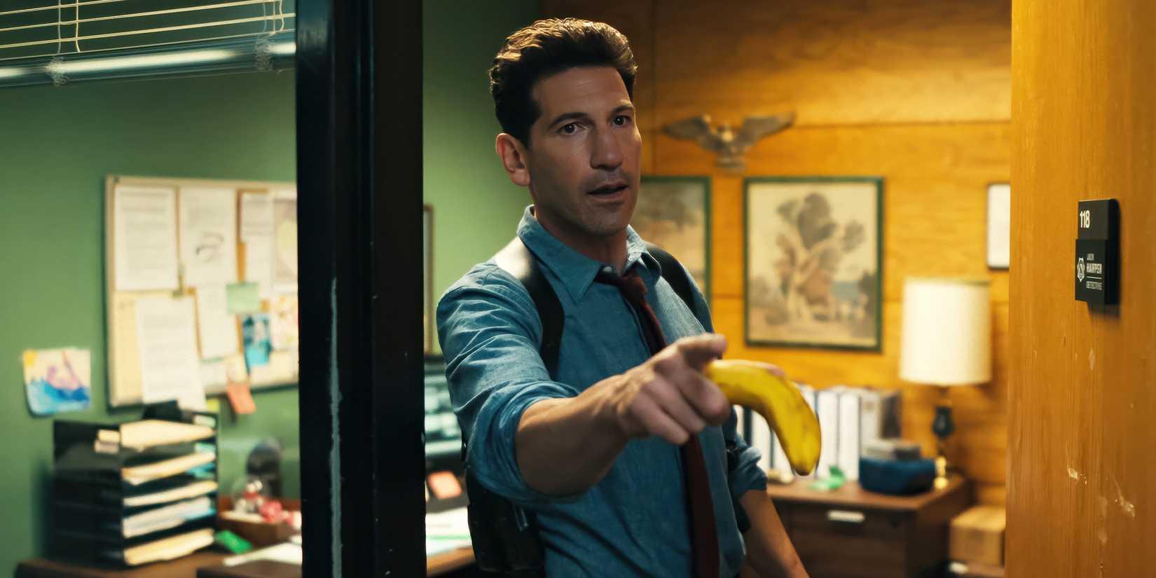 Jon Bernthal's Jack Harper pointing with a banana in His & Hers