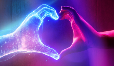 A glowing hand meets a human hand to form a heart shape