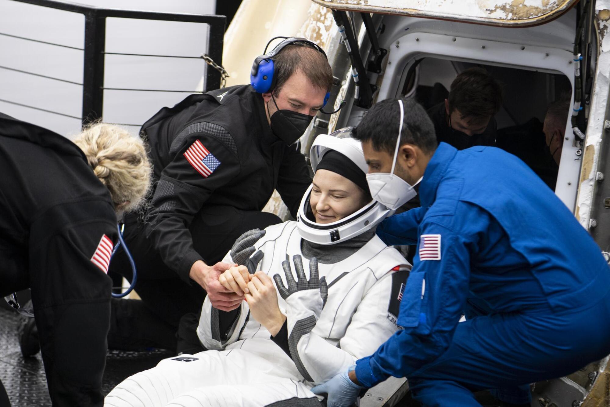 Kayla Barron getting out of SpaceX Crew Dragon capsule