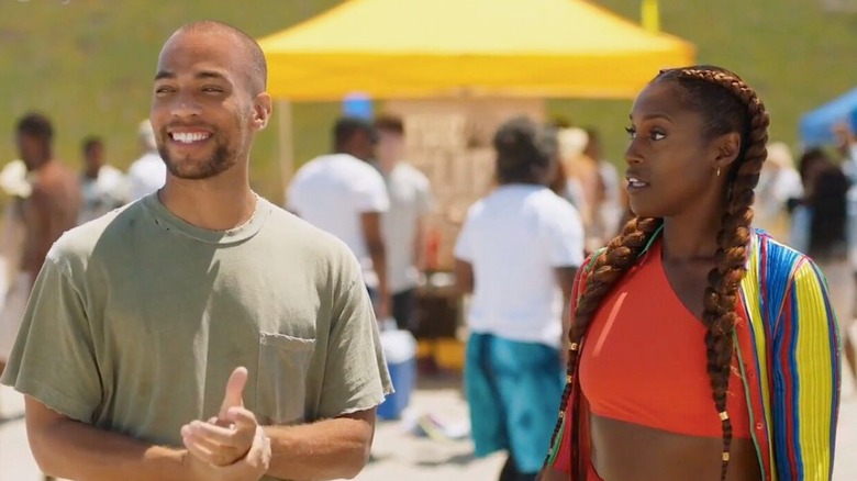 Issa Rae as Issa Dee and Kendrick Sampson as Nathan Campbell, standing next to each other at the beach in a scene from 