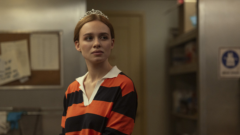 Percy Fraser wearing a striped shirt and tiara, looking sad