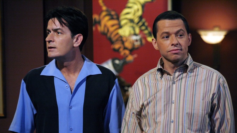 Charlie Harper and Alan Harper enter a restaurant in 