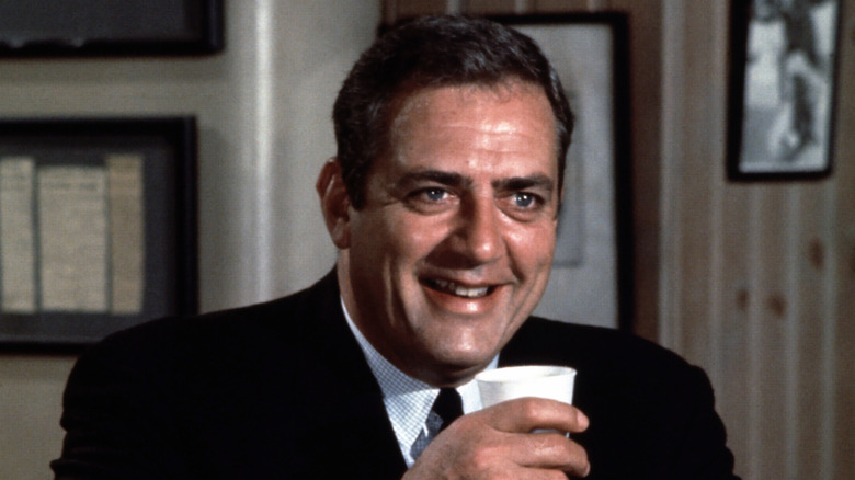 Robert T. Ironside laughs while taking a drink in 