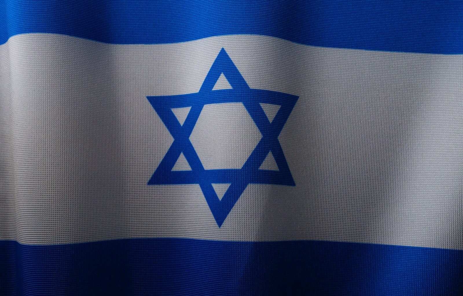 a close up of a flag with a star of david on it