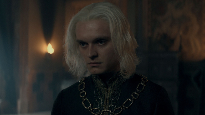 Tom Glynn-Carney as Aegon II frowning in House of the Dragon