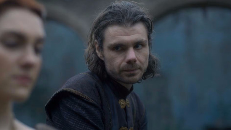 Matthew Needham as Larys looking at Emily Carey as Alicent in House of the Dragon