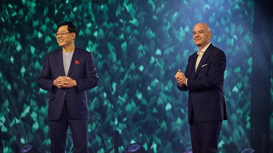Lenovo CEO Yang Yuanqing and FIFA President Gianni Infantino