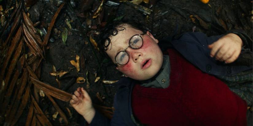 Piggy (David McKenna) lying on the ground in 'Lord of the Flies'