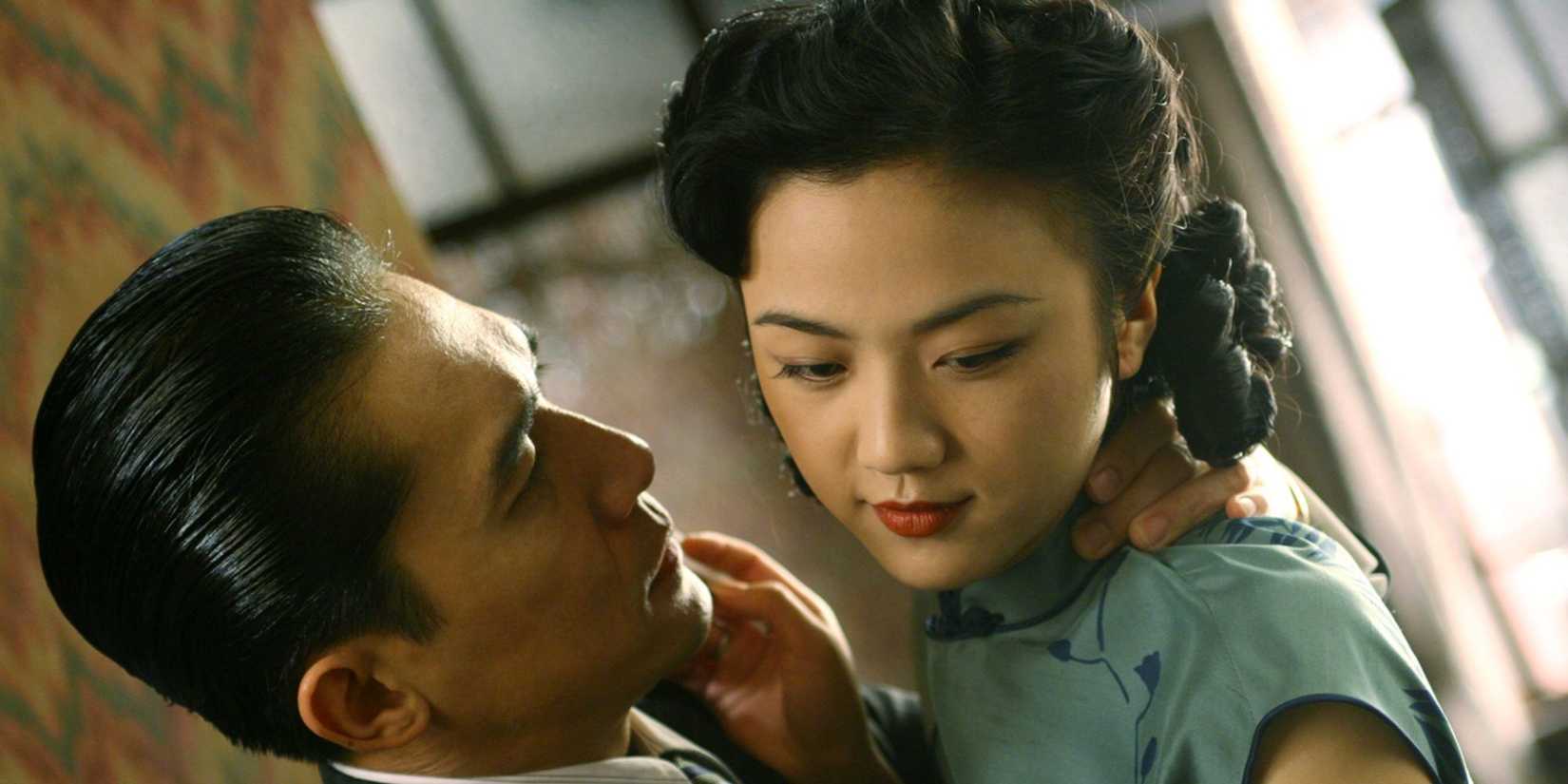Tony Leung as Mr. Yee Wong looking at Tang Wei as Chia Chi in Lust, Caution.