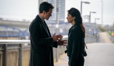 a man and woman talking on a bridge