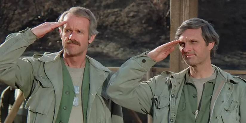 B. J. (Mike Farrell) and Hawkeye (Alan Alda) saluting in the 'M*A*S*H' series finale.