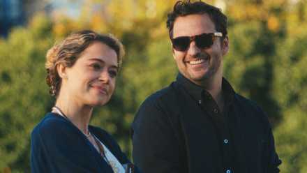 Tatiana Maslany and Jake Johnson smiling next to each other in Maximum Pleasure Guaranteed